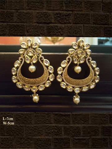 art deco sapphire earrings-Matt finish intricate carving kundan and AD earring